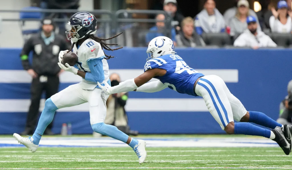 Indianapolis Colts linebacker E.J. Speed (45) dives after Tennessee Titans wide receiver DeAndre Hopkins (10) as he rushes the ball Sunday, Oct. 8, 2023, during a game against the Tennessee Titans at Lucas Oil Stadium in Indianapolis.