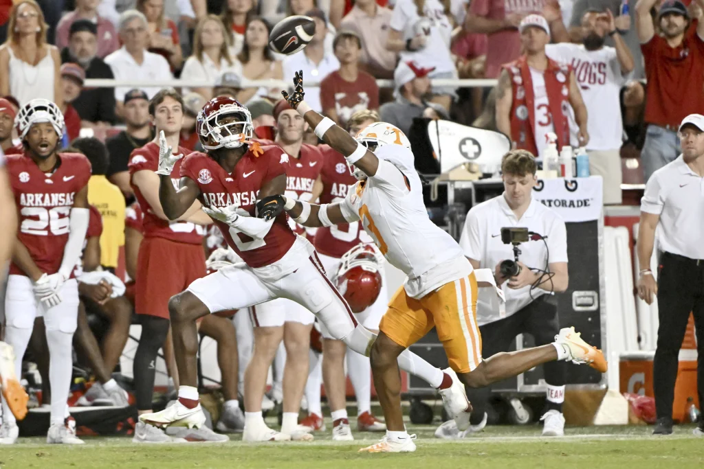 Arkansas wide receiver Andrew Armstrong (2) makes a catch in front of Tennessee defensive back Jermod McCoy (3) during the second half of an NCAA college football game Saturday, Oct. 5, 2024, in Fayetteville, Ark. (AP Photo/Michael Woods)