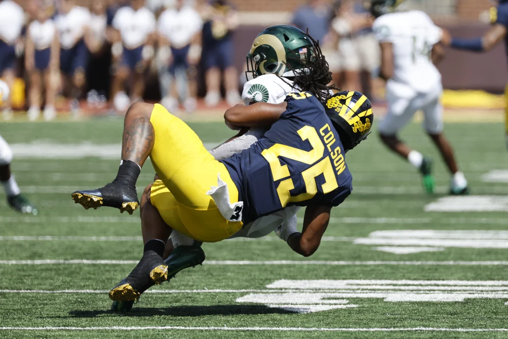 Sep 3, 2022; Ann Arbor, Michigan, USA; Colorado State Rams running back A Jon Vivens (1) is tackled by Michigan Wolverines linebacker Junior Colson (25) in the first half at Michigan Stadium. Mandatory Credit: Rick Osentoski-USA TODAY Sports