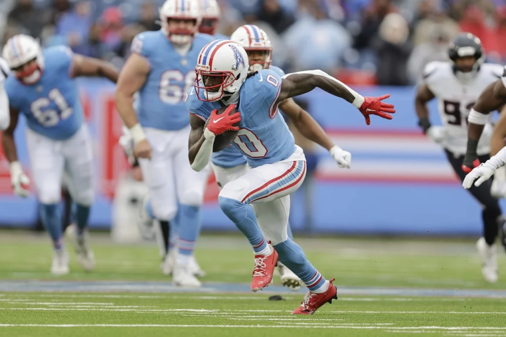 Tennessee Titans wide receiver Calvin Ridley (0) runs with the ball during the first half of an NFL football game against the Houston Texans, Jan. 5, 2025, in Nashville, Tenn. (AP Photo/Stew Milne)