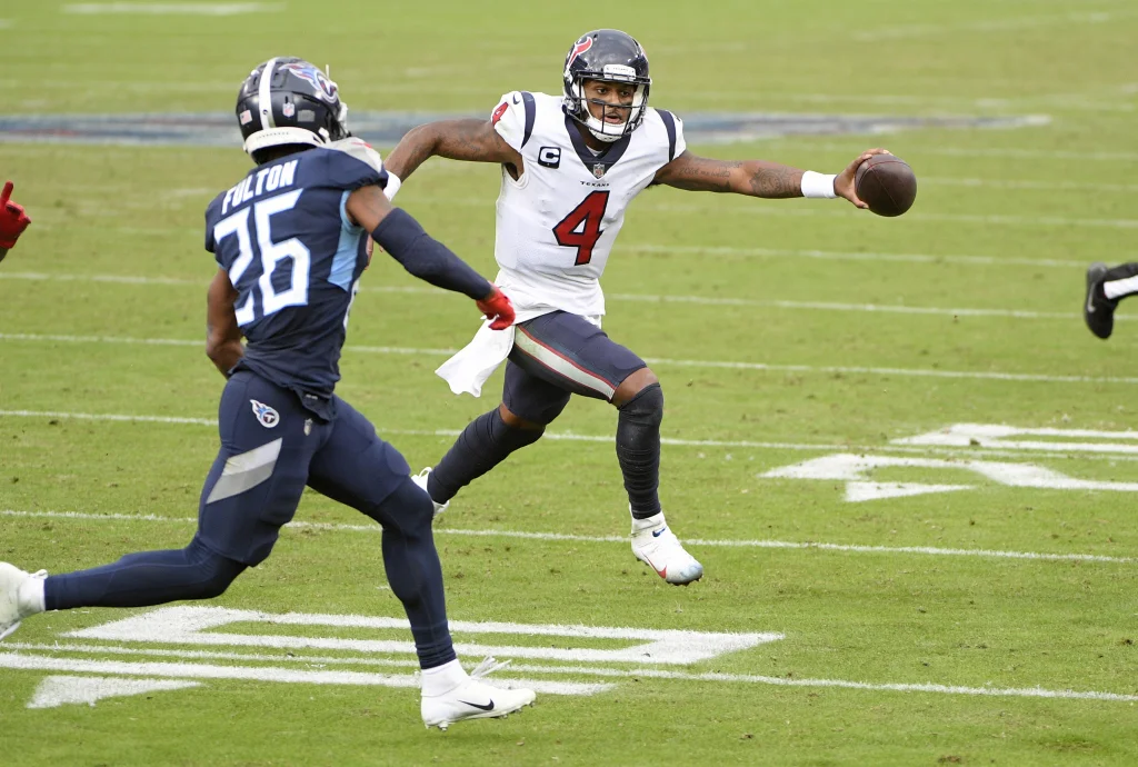 Oct 18, 2020; Nashville, Tennessee, USA; Houston Texans quarterback Deshaun Watson (4) runs against Tennessee Titans cornerback Kristian Fulton (26) during the second half at Nissan Stadium. Mandatory Credit: Steve Roberts-USA TODAY Sports