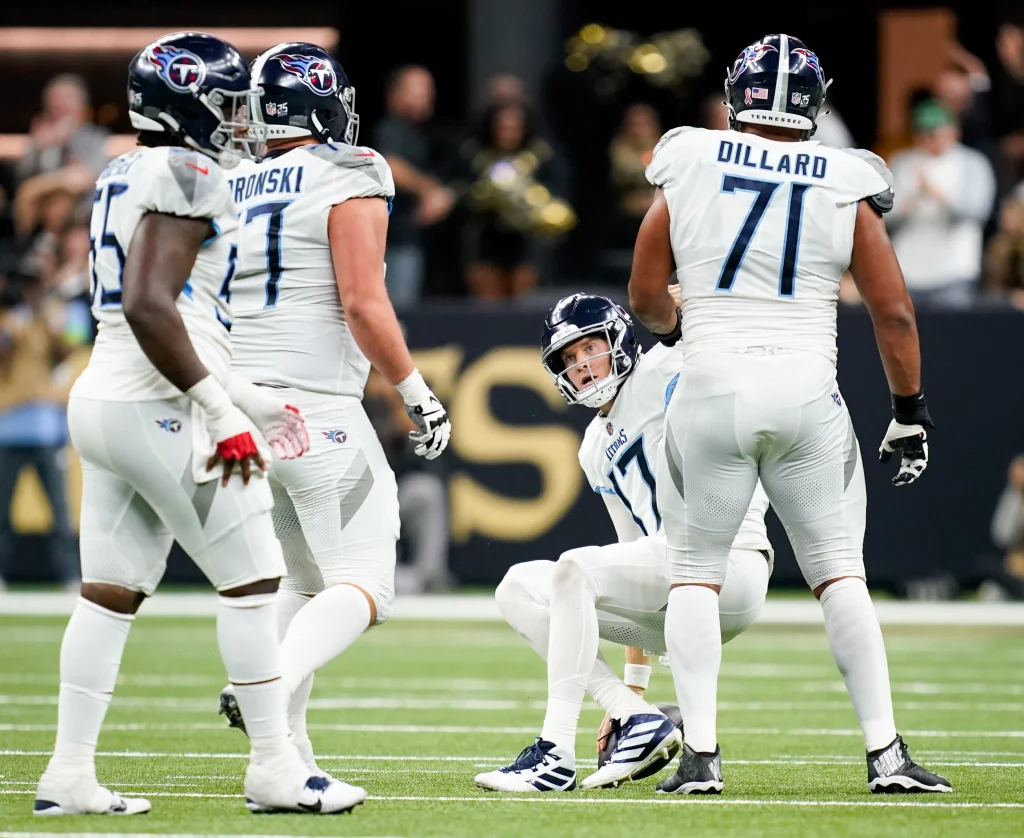 Sep 10, 2023; New Orleans, LA, USA; Tennessee Titans quarterback Ryan Tannehill (17) is helped up after being sacked in the third quarter against the New Orleans Saints at Caesars Superdome. Mandatory Credit: Andrew Nelles-USA TODAY Sports
