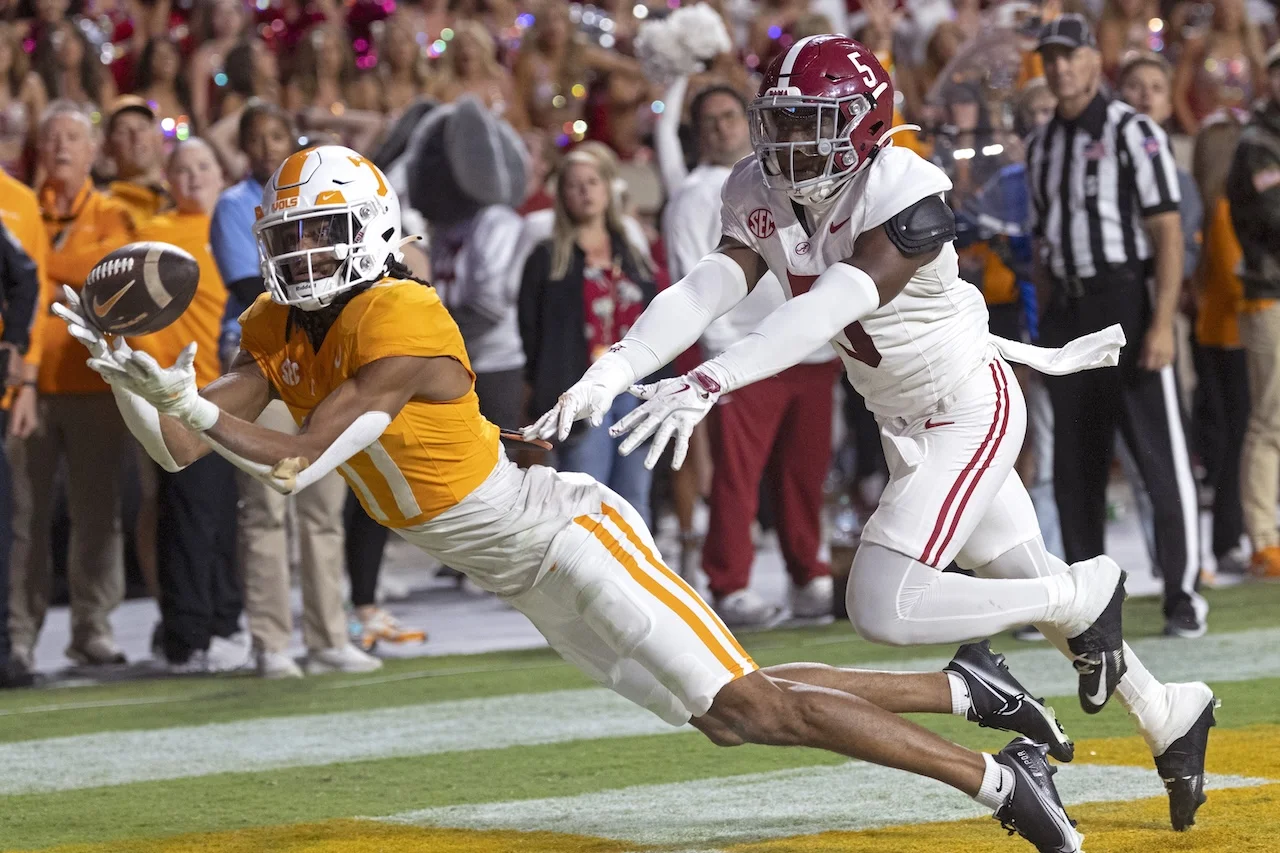 Tennessee wide receiver Chris Brazzell II (17) catches a pass for a touchdown as he's defended by Alabama defensive back King Mack (5) during the second half of an NCAA college football game Saturday, Oct. 19, 2024, in Knoxville, Tenn. (AP Photo/Wade Payne)