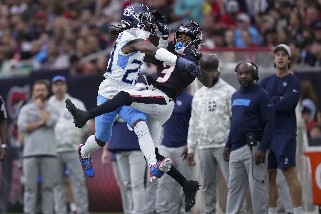 Tennessee Titans cornerback Jarvis Brownlee Jr., left, breaks up a pass intended for Houston Texans wide receiver Tank Dell (3) during the first half of an NFL football game Sunday, Nov. 24, 2024, in Houston. (AP Photo/Eric Christian Smith)