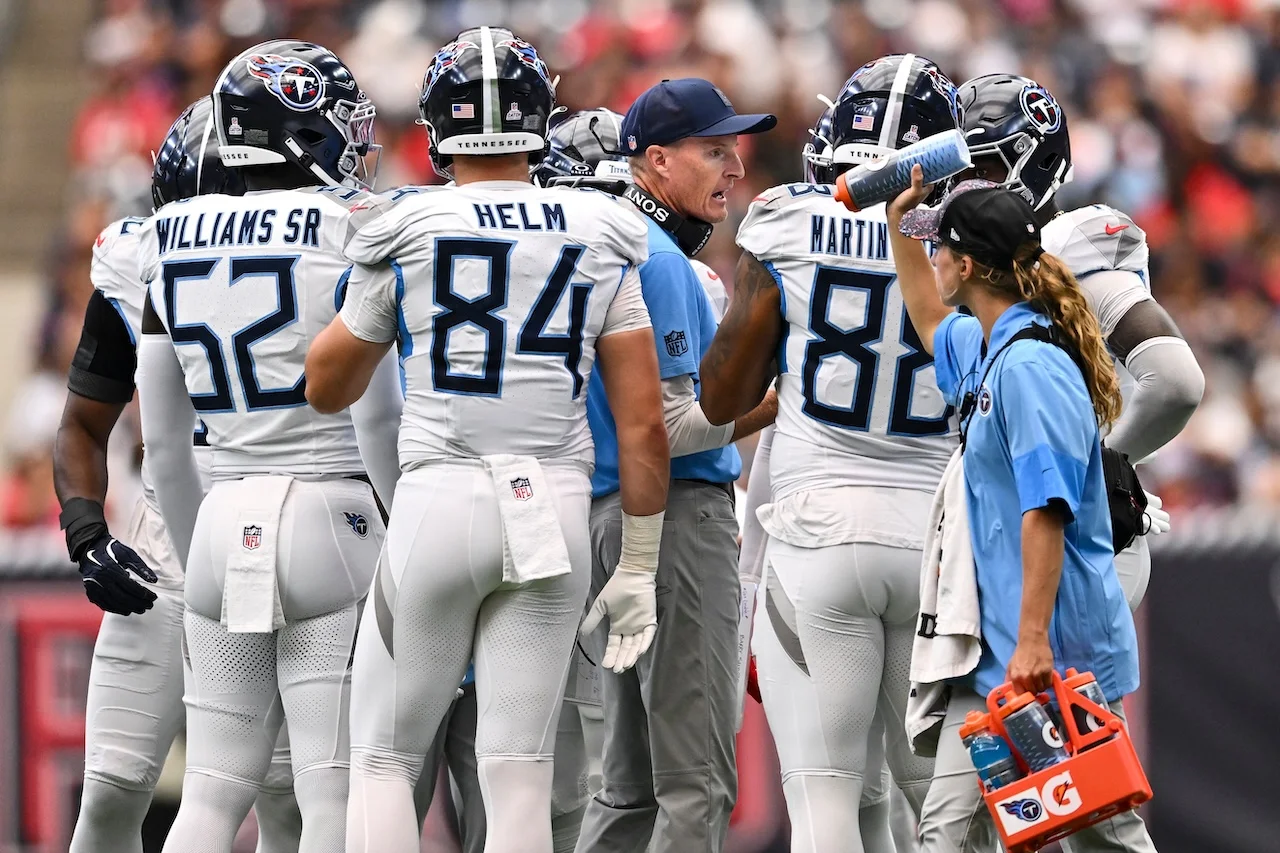Tennessee Titans special teams coordinator John Fassel stands in the huddle during the first half of an NFL football game against the Houston Texans, Sunday, Sep. 28, 2025, in Houston. (AP Photo/Maria Lysaker)