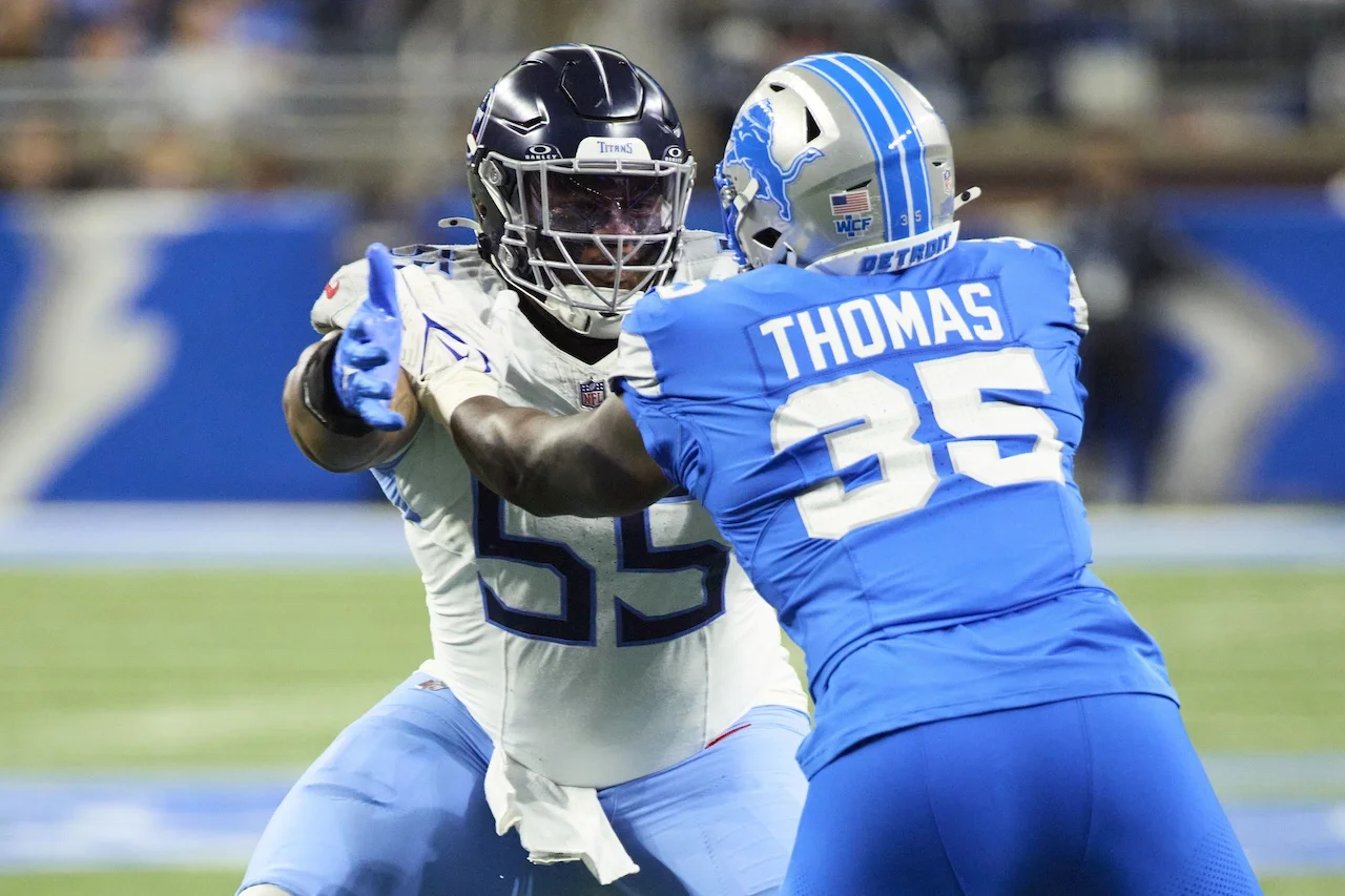 Tennessee Titans offensive tackle JC Latham (55) blocks Detroit Lions defensive end Isaiah Thomas (35) during an NFL football game in Detroit, Sunday, Oct. 27, 2024. (AP Photo/Rick Osentoski)