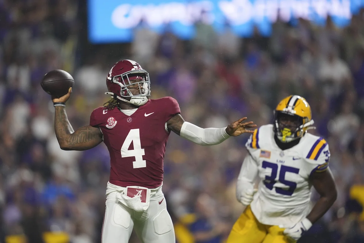 Alabama quarterback Jalen Milroe (4) passes in the first half of an NCAA college football game against LSU in Baton Rouge, La., Saturday, Nov. 9, 2024. (AP Photo/Gerald Herbert)