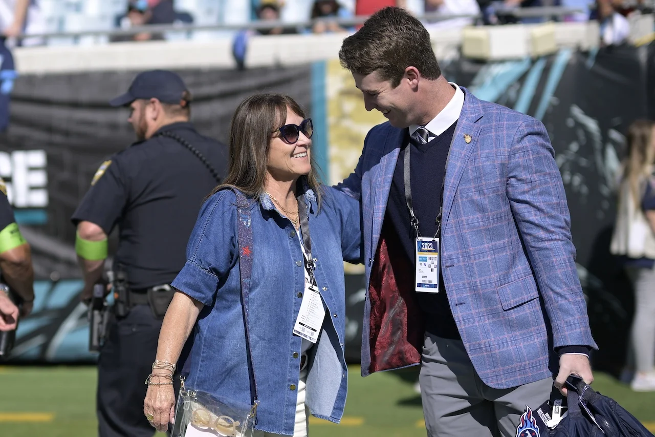 Tennessee Titans owner Amy Adams Strunk, left, talks with Bryce Wasserman before an NFL football game against the Jacksonville Jaguars, Sunday, Nov. 19, 2023, in Jacksonville, Fla. (AP Photo/Phelan M. Ebenhack)
