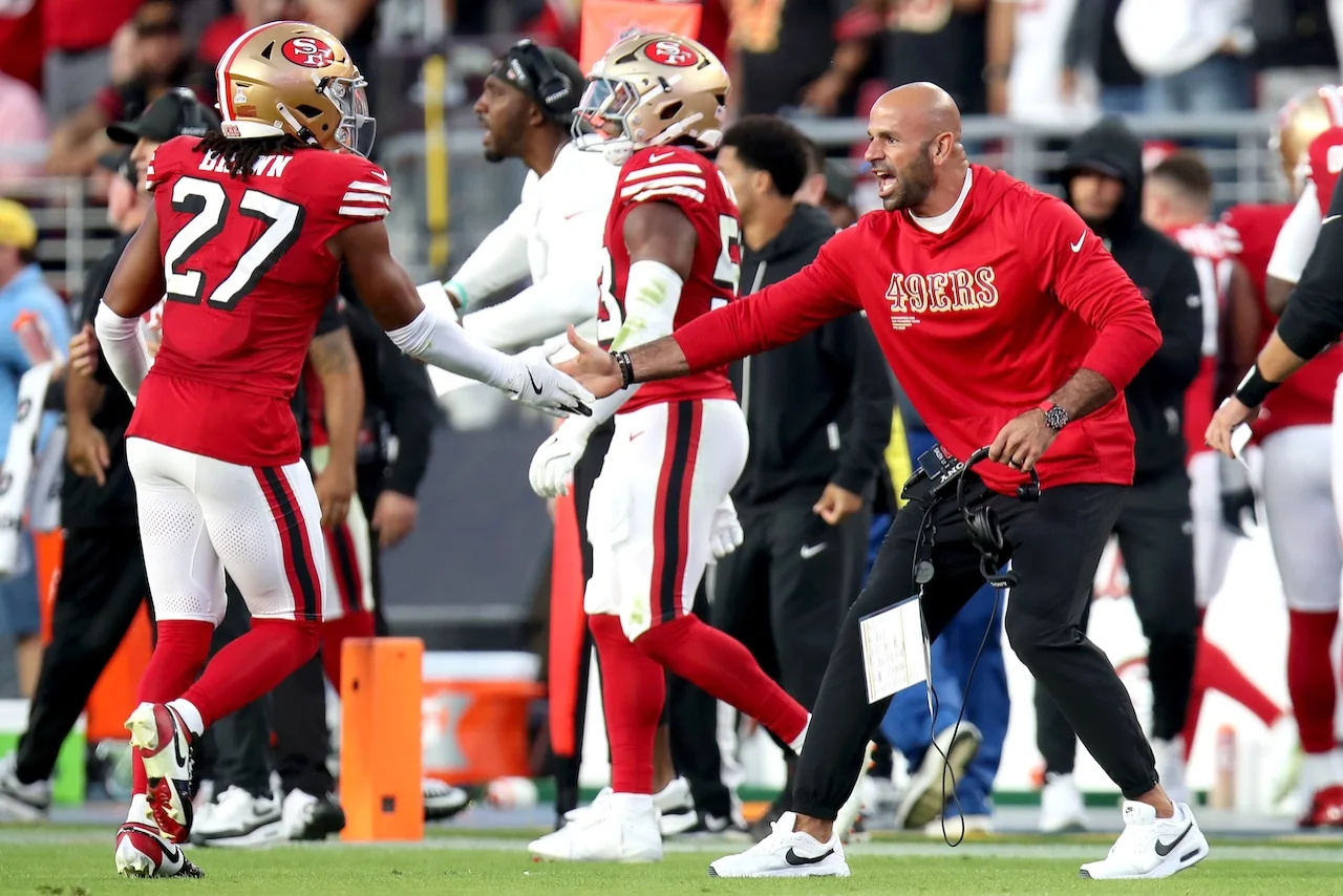 San Francisco 49ers defensive coordinator Robert Saleh congratulates safety Ji'Ayir Brown (27) during an NFL football game, Sunday, Sept. 28, 2025, in Santa Clara, Calif. (AP Photo/Scot Tucker)