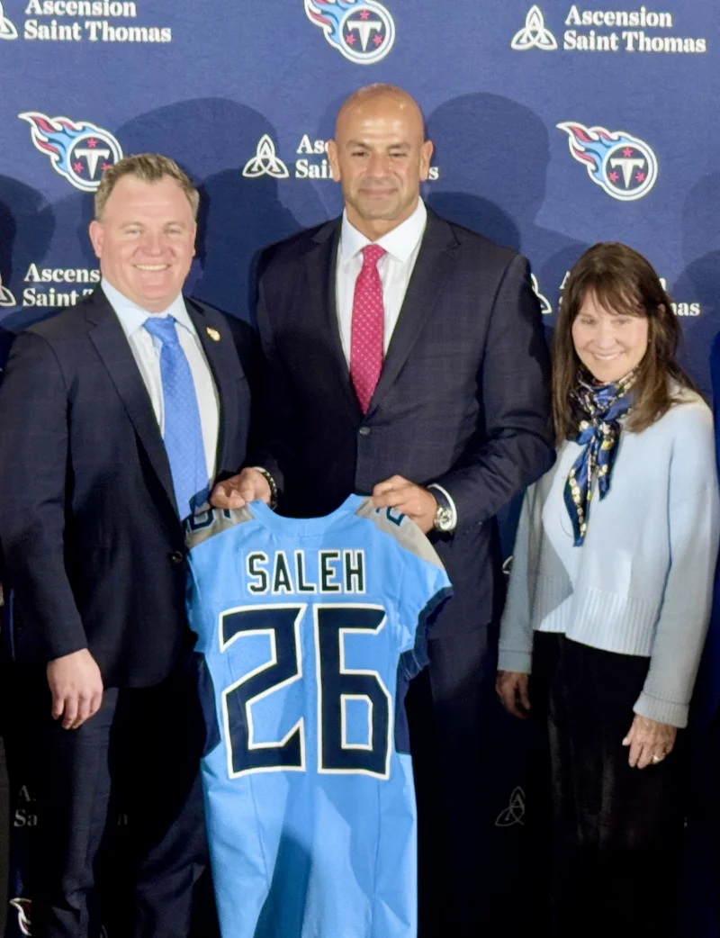 Mike Borgonzi, Robert Saleh and Amy Adams Strunk