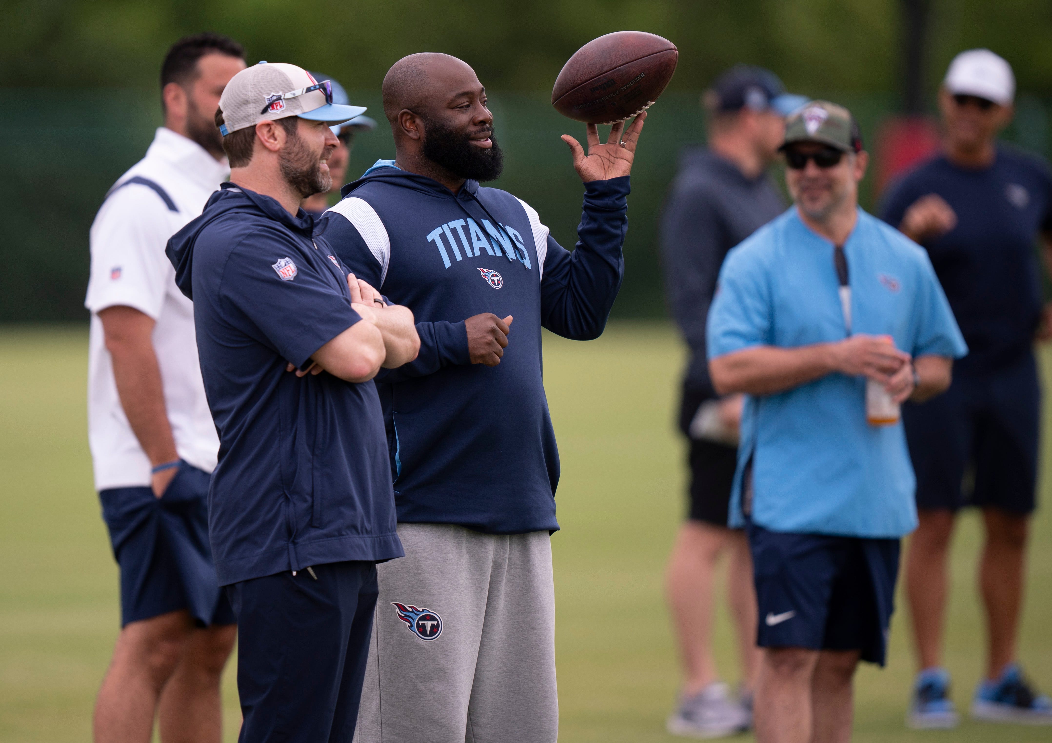 Tennessee Titans Head Coach Brian Callahan, left, and General Manager Ran Carthon, with ball, take in practice during rookie minicamp at Ascension Saint Thomas Sports Park in Nashville, Tenn., Friday, May 10, 2024.